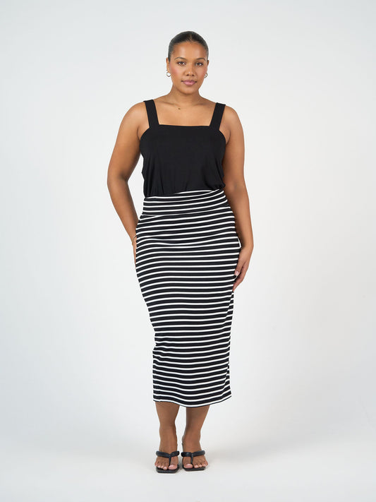 Image of a model wearing Skirts. Product name - Maxi Bamboo Whitney Tube Skirt Black & White Stripe in Black & White Stripe colour by brand - Lou Lou