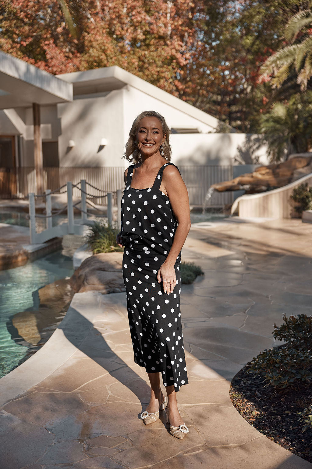 Image of a model wearing Tops. Product name - Charli Bamboo Cami Polka Dot in Polka Dot colour by brand - Lou Lou