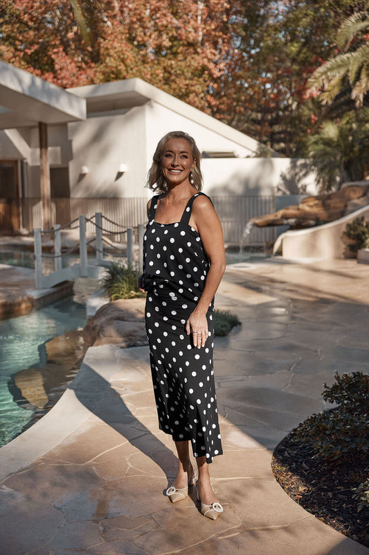 Image of a model wearing Tops. Product name - Charli Bamboo Cami Polka Dot in Polka Dot colour by brand - Lou Lou