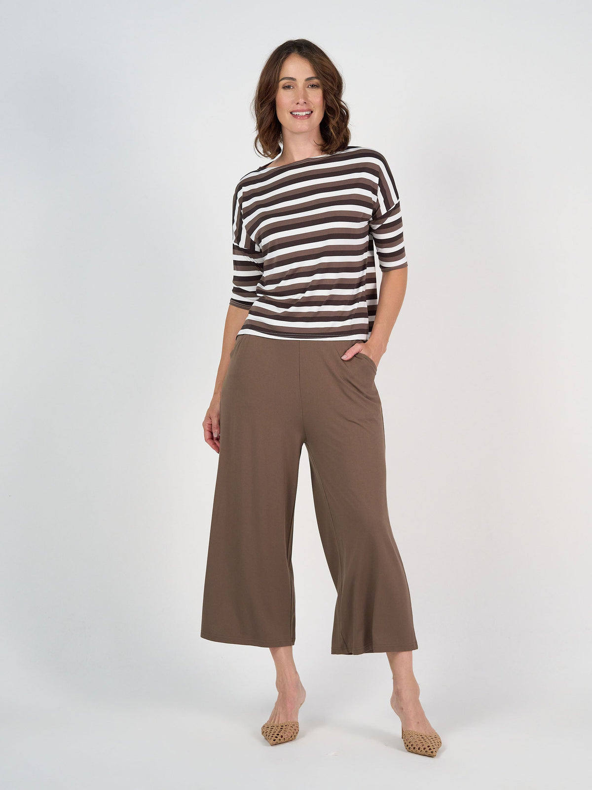 Image of a model wearing Pants. Product name - Ciara 7/8 Length Bamboo Culotte Pant Chocolate in Chocolate colour by brand - Lou Lou