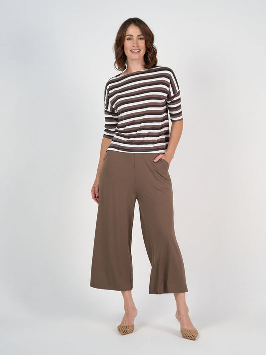 Image of a model wearing Pants. Product name - Ciara 7/8 Length Bamboo Culotte Pant Chocolate in Chocolate colour by brand - Lou Lou