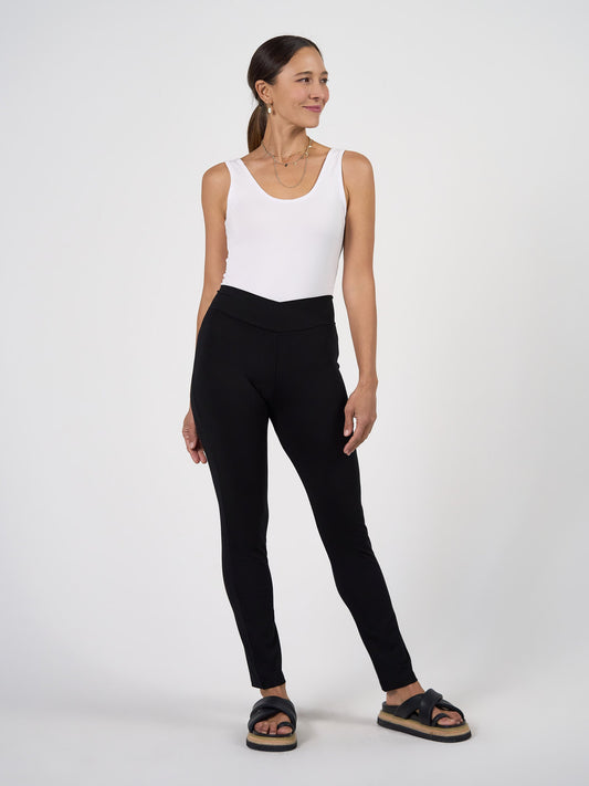 Image of a model wearing Pants. Product name - Patti Bamboo Full-Length Pant in Black colour by brand - Lou Lou