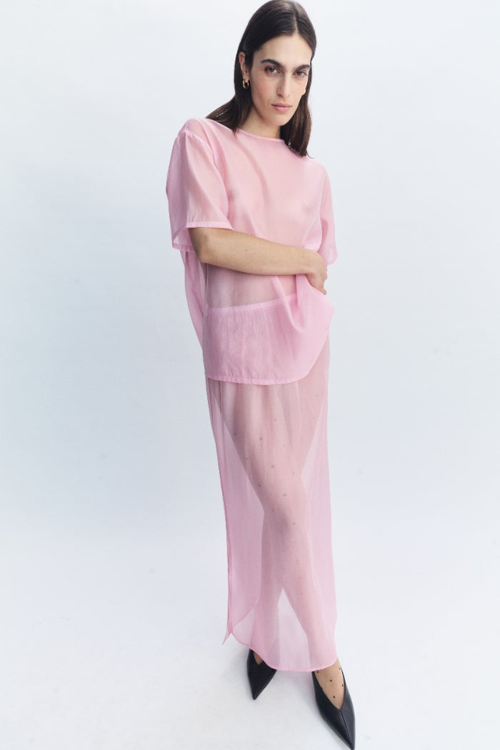Image of a model wearing Skirts. Product name - Cora Skirt Pink in Pink colour by brand - Blanca Studio