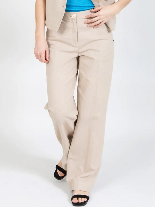 Image of a model wearing Pants. Productname: COSTER WIDE LEG PANT in Sand colour by brand - Coster