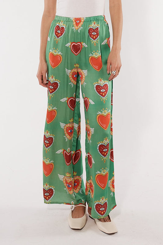 Image of a model wearing Pants. Productname: Cowgirl Surfer Bettina Pant Emerald in Emerald colour by brand - Cowgirl Surfer