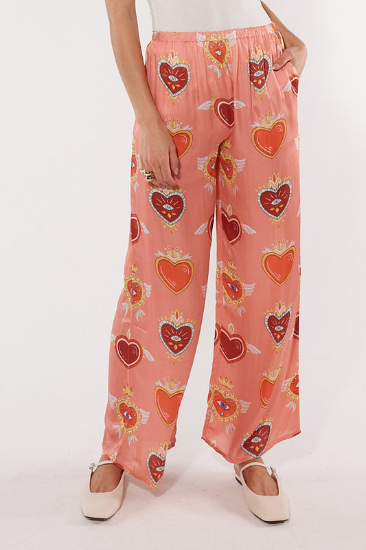 Image of a model wearing Pants. Productname: Cowgirl Surfer Bettina Pant Blush in Blush colour by brand - Cowgirl Surfer