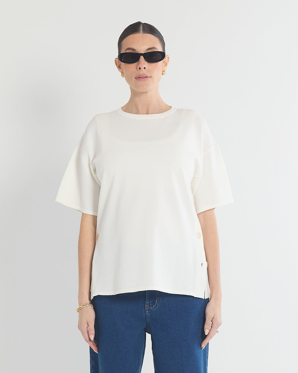 Image of a model wearing Tops. Product name - Crepe Knit Button Feeding Top in colour by brand - Soon Maternity