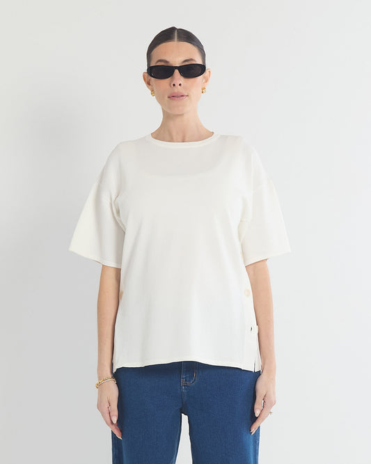 Image of a model wearing Tops. Product name - Crepe Knit Button Feeding Top in colour by brand - Soon Maternity