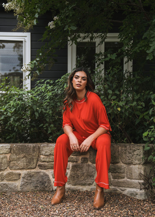 Image of a model wearing Pants. Product name - Carey Bamboo Culotte Fiery Red in Fiery Red colour by brand - Lou Lou