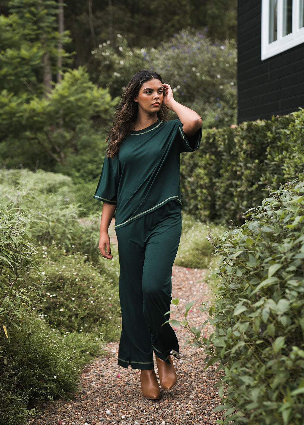 Image of a model wearing Tops. Product name - Spears Bamboo T-Shirt Dark Green in Dark Green colour by brand - Lou Lou