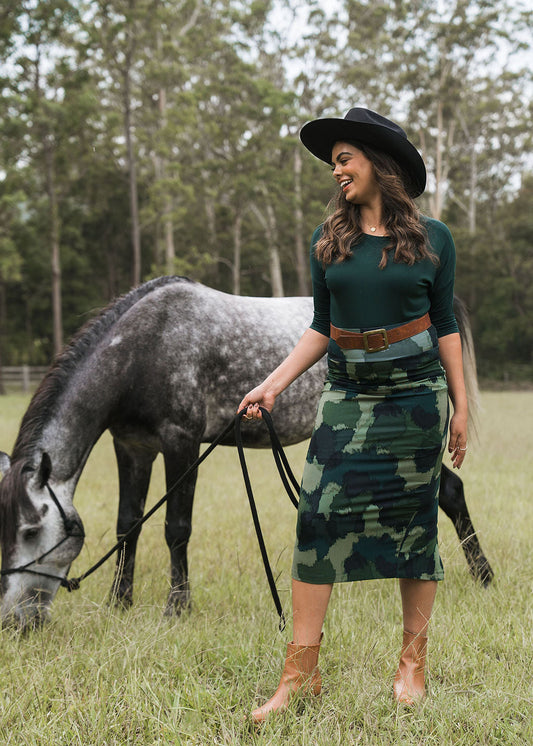 Image of a model wearing Skirts. Product name - Maxi Bamboo Whitney Tube Skirt Camouflage in Camouflage colour by brand - Lou Lou