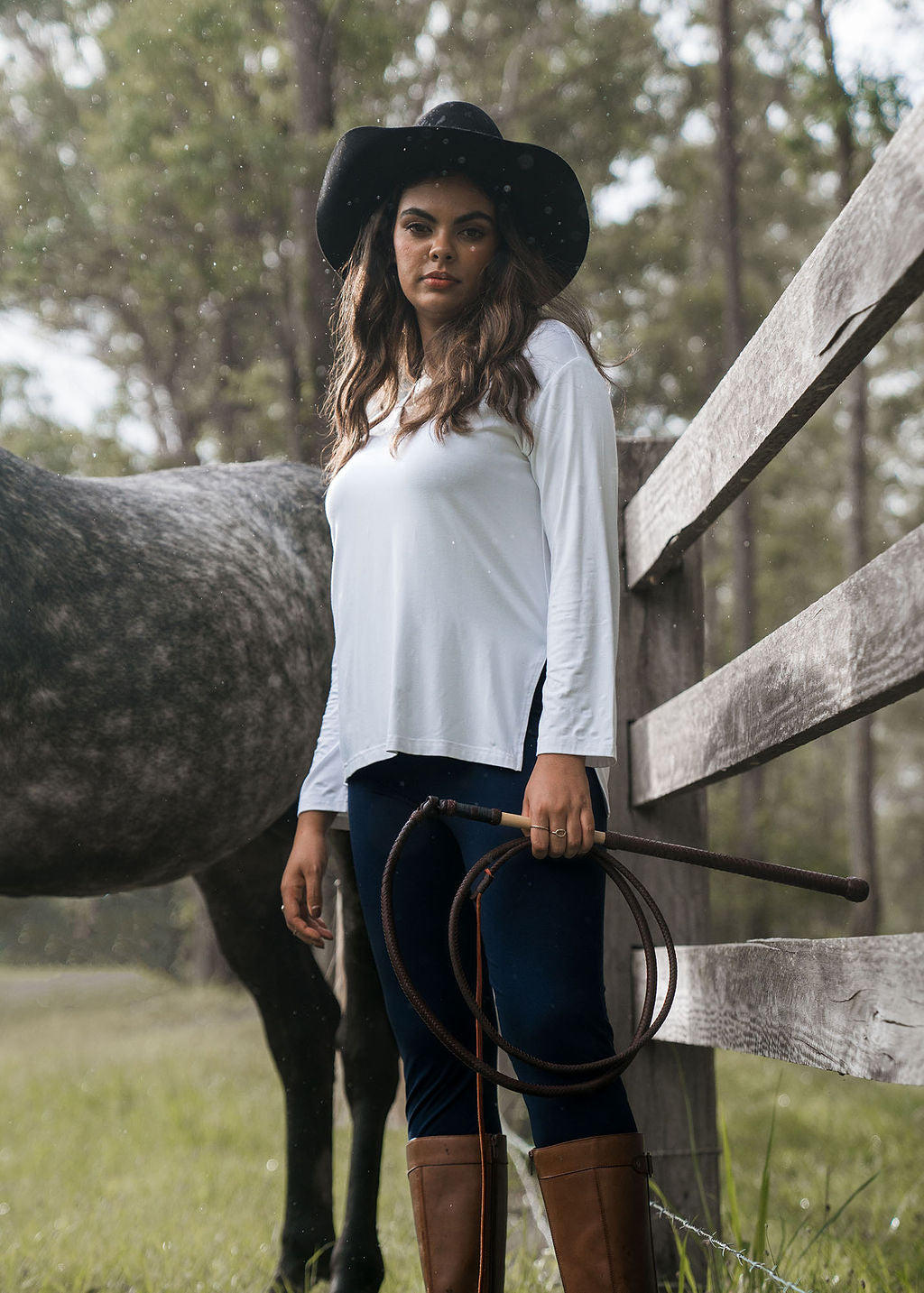 Image of a model wearing Tops. Product name - Braxton Bamboo Long Sleeve Top White in White colour by brand - Lou Lou