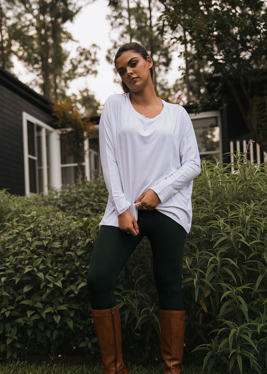 Image of a model wearing Pants. Product name - Luxe Bamboo Full-Length Legging Dark Green in Dark Green colour by brand - Lou Lou