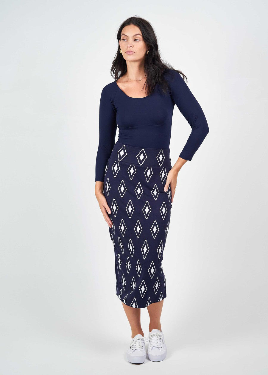 Image of a model wearing Tops. Product name - Ava 3/4 Sleeve Cropped Bamboo Top in Navy colour by brand - Lou Lou