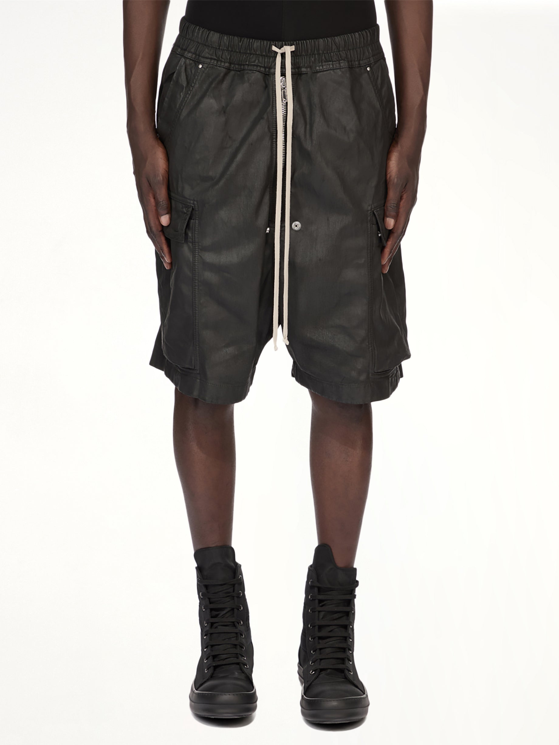 Image of a model wearing Shorts. Product name - Denim Cargobela Shorts in Black colour by brand - RICK OWENS DRKSHDW