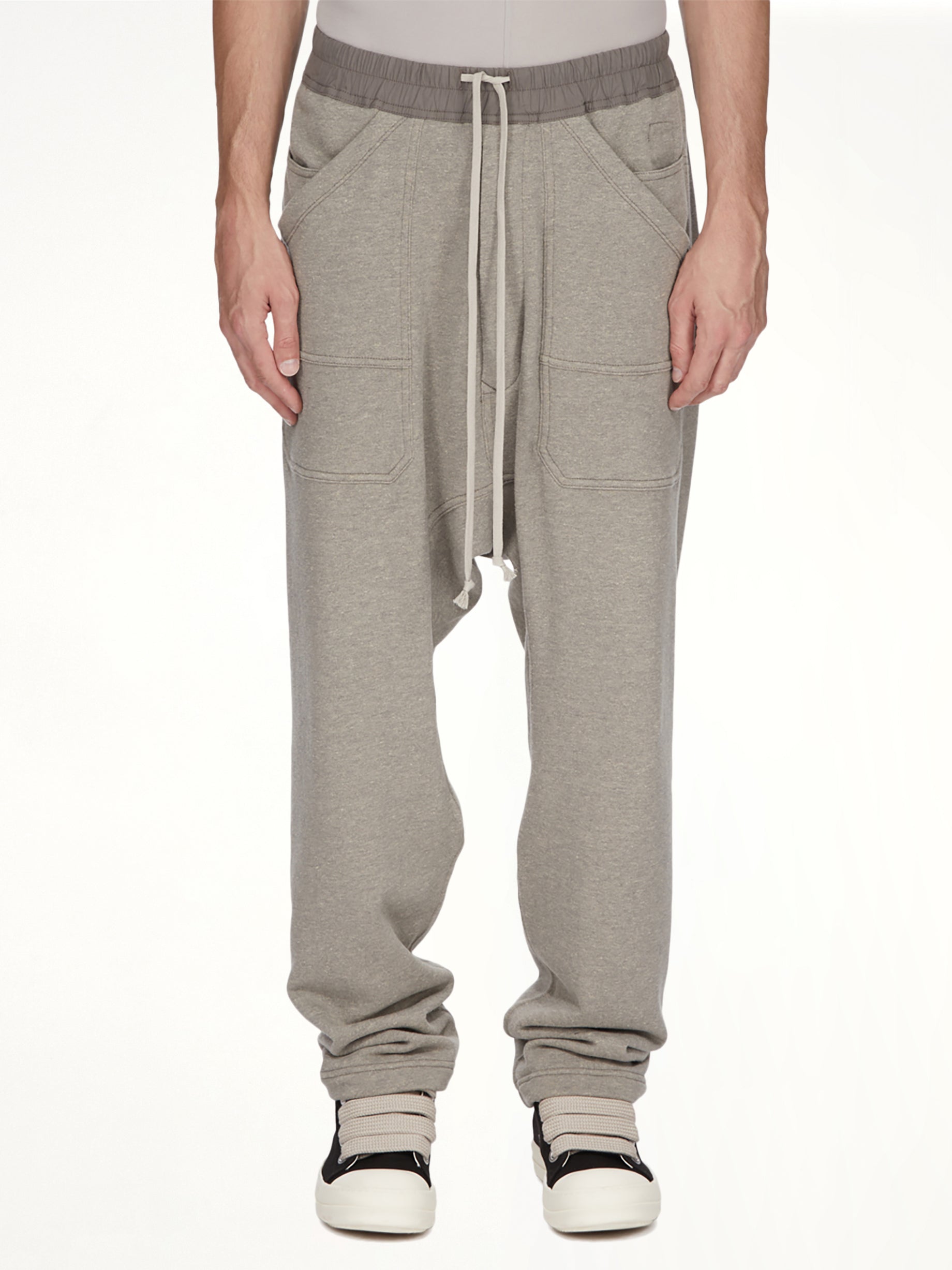 Image of a model wearing Pants. Product name - Classic Cargo Drawstring in Grey colour by brand - RICK OWENS DRKSHDW