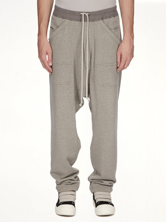 Image of a model wearing Pants. Product name - Classic Cargo Drawstring in Grey colour by brand - RICK OWENS DRKSHDW