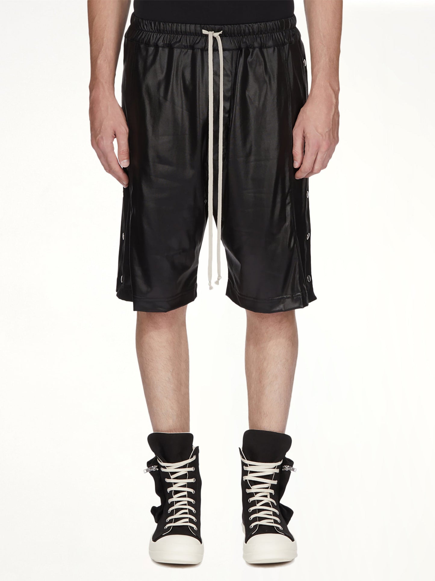 Image of a model wearing Shorts. Product name - Wide Pusher Shorts in Black colour by brand - RICK OWENS DRKSHDW