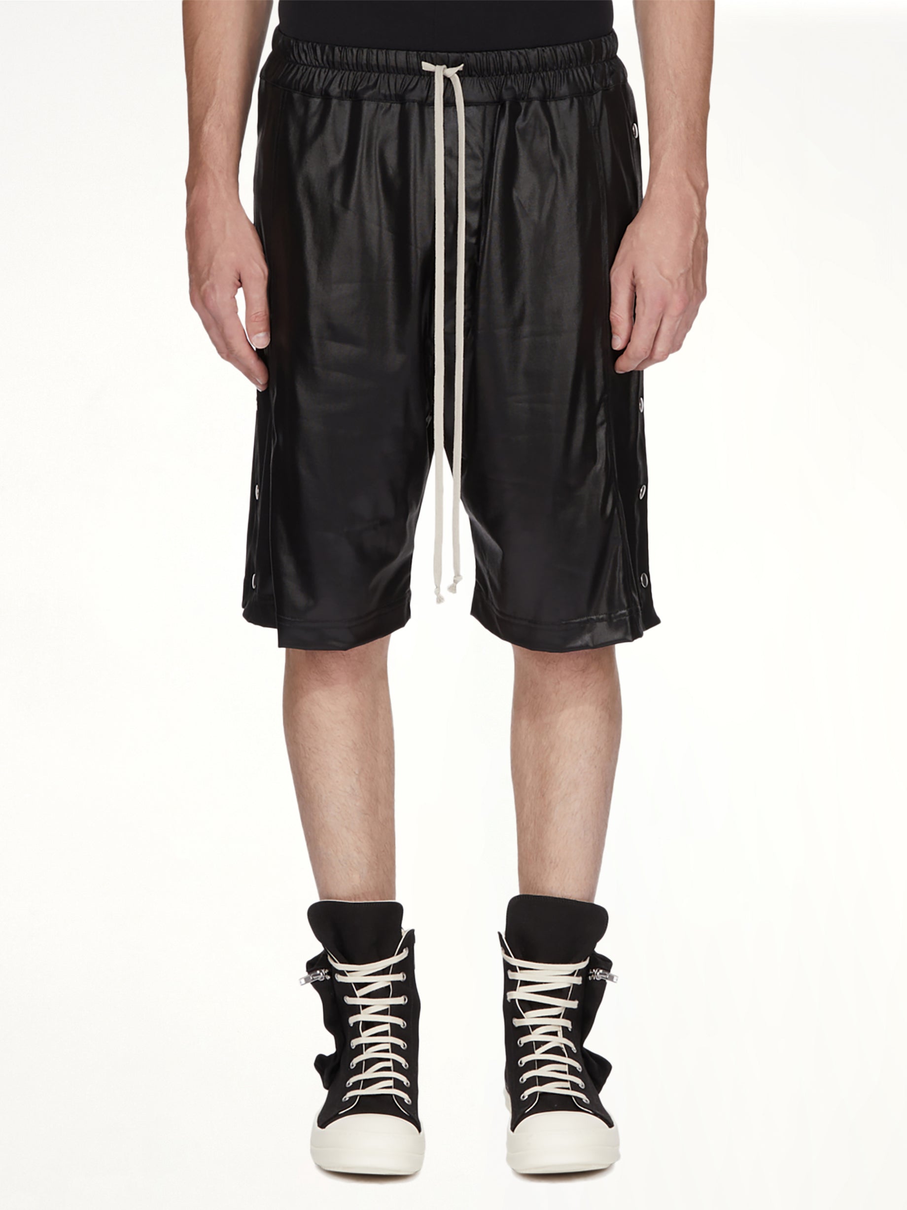 Image of a model wearing Shorts. Product name - Wide Pusher Shorts in Black colour by brand - RICK OWENS DRKSHDW