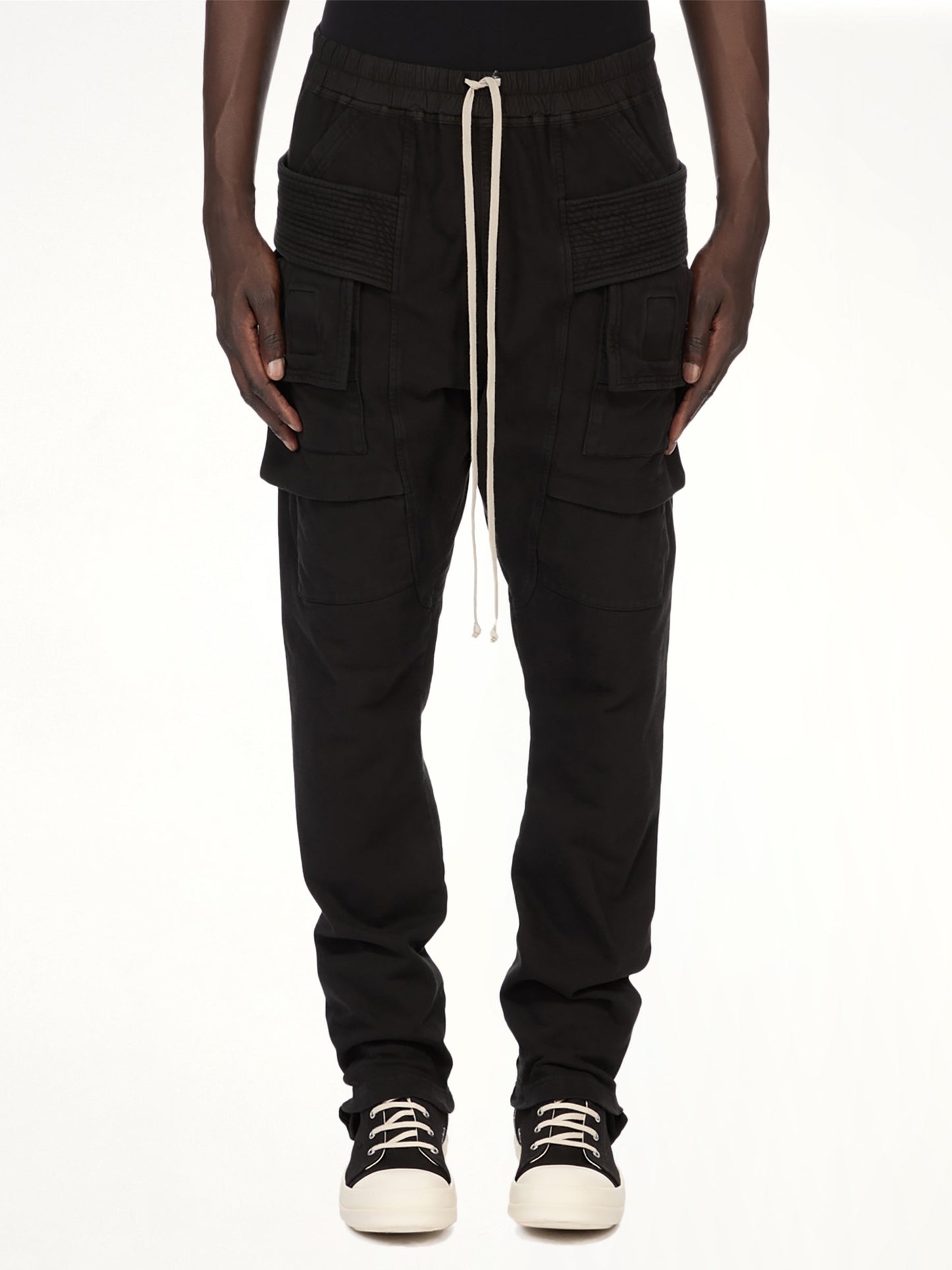Image of a model wearing Pants. Product name - Creatch Cargo Drawstring in Black colour by brand - RICK OWENS DRKSHDW