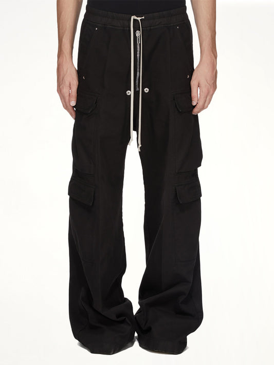 Image of a model wearing Pants. Product name - Double Cargo Jumbo Belas in Black colour by brand - RICK OWENS DRKSHDW