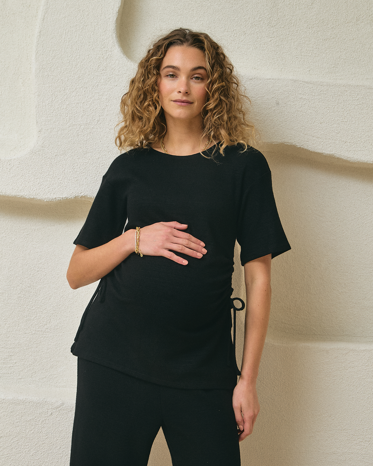 Image of a model wearing Tops. Product name - Danielle Knit Top in colour by brand - Soon Maternity