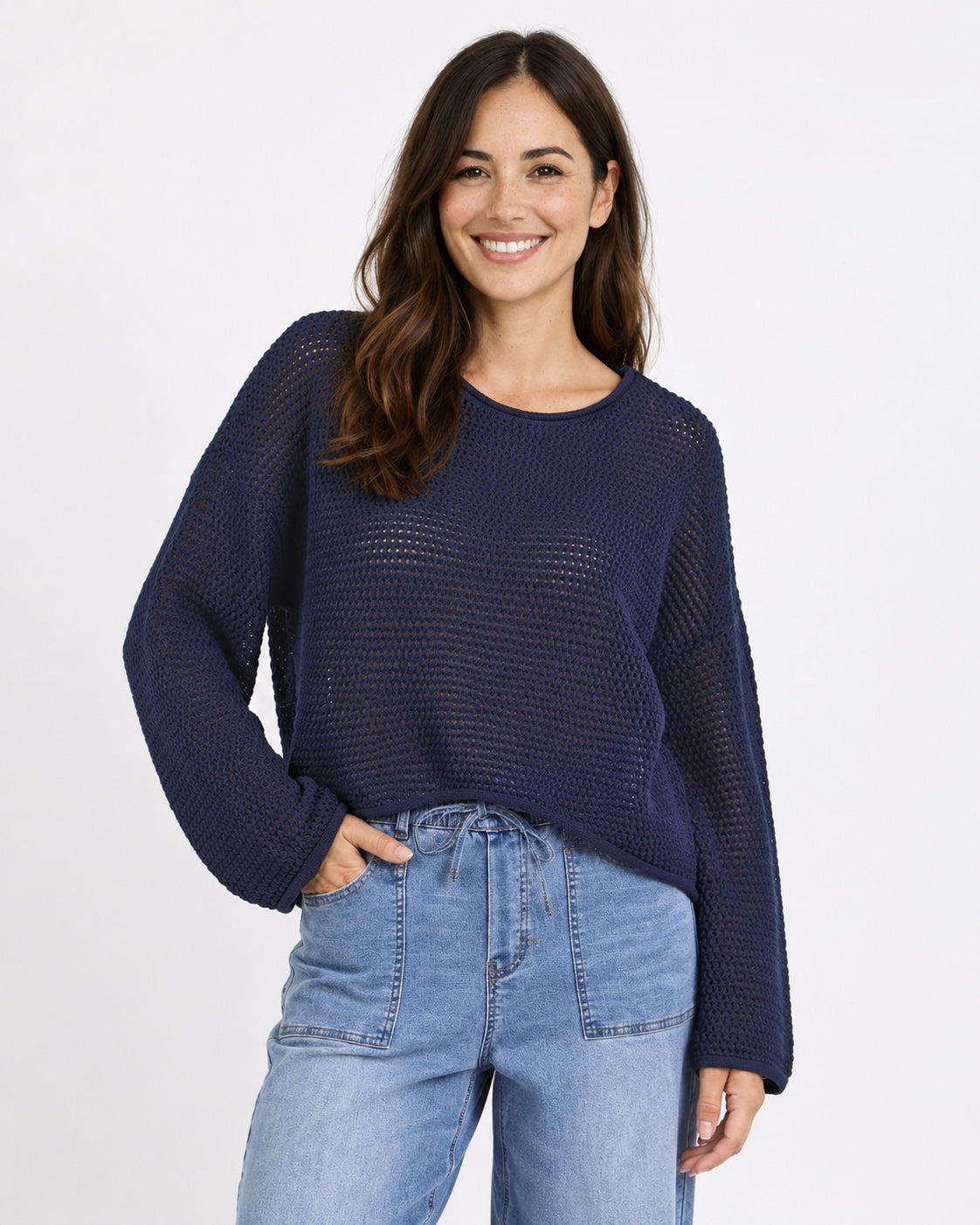 Image of a model wearing Outerwear. Product name - Dawn Crochet Knit Jumper Ink in Ink colour by brand - Re:Union The Label