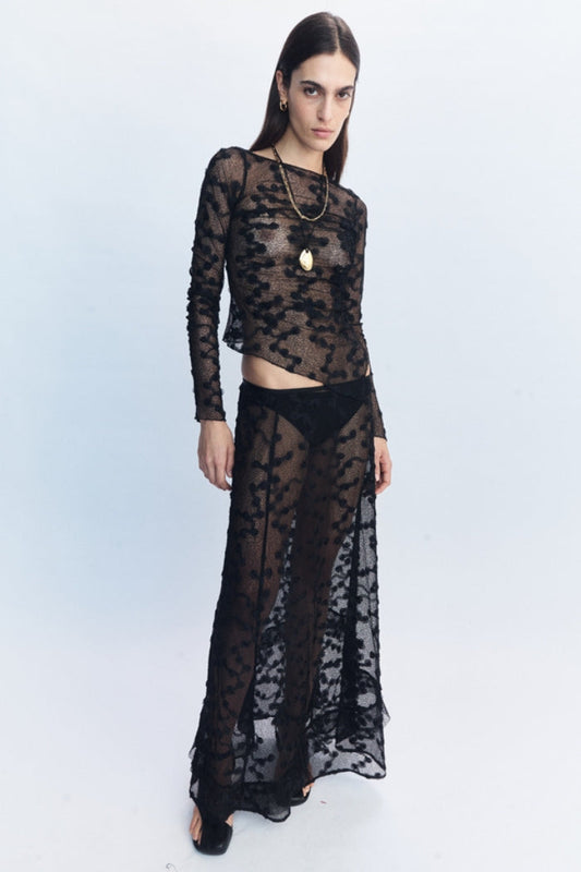 Image of a model wearing Skirts. Product name - Delphina Lace Skirt Black in Black colour by brand - Blanca Studio