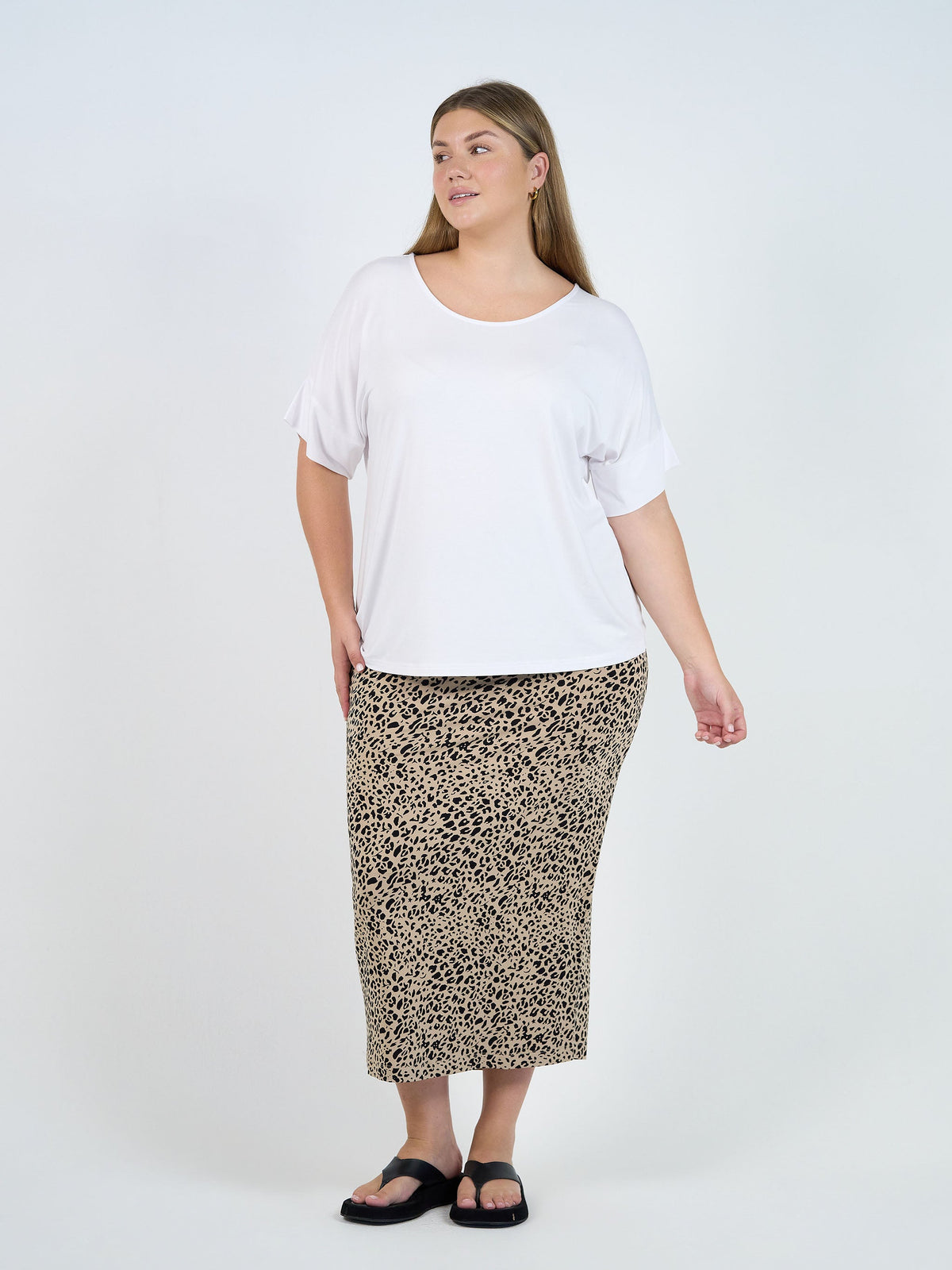Image of a model wearing Tops. Product name - Demi Oversized Bamboo Box T-Shirt White in White colour by brand - Lou Lou