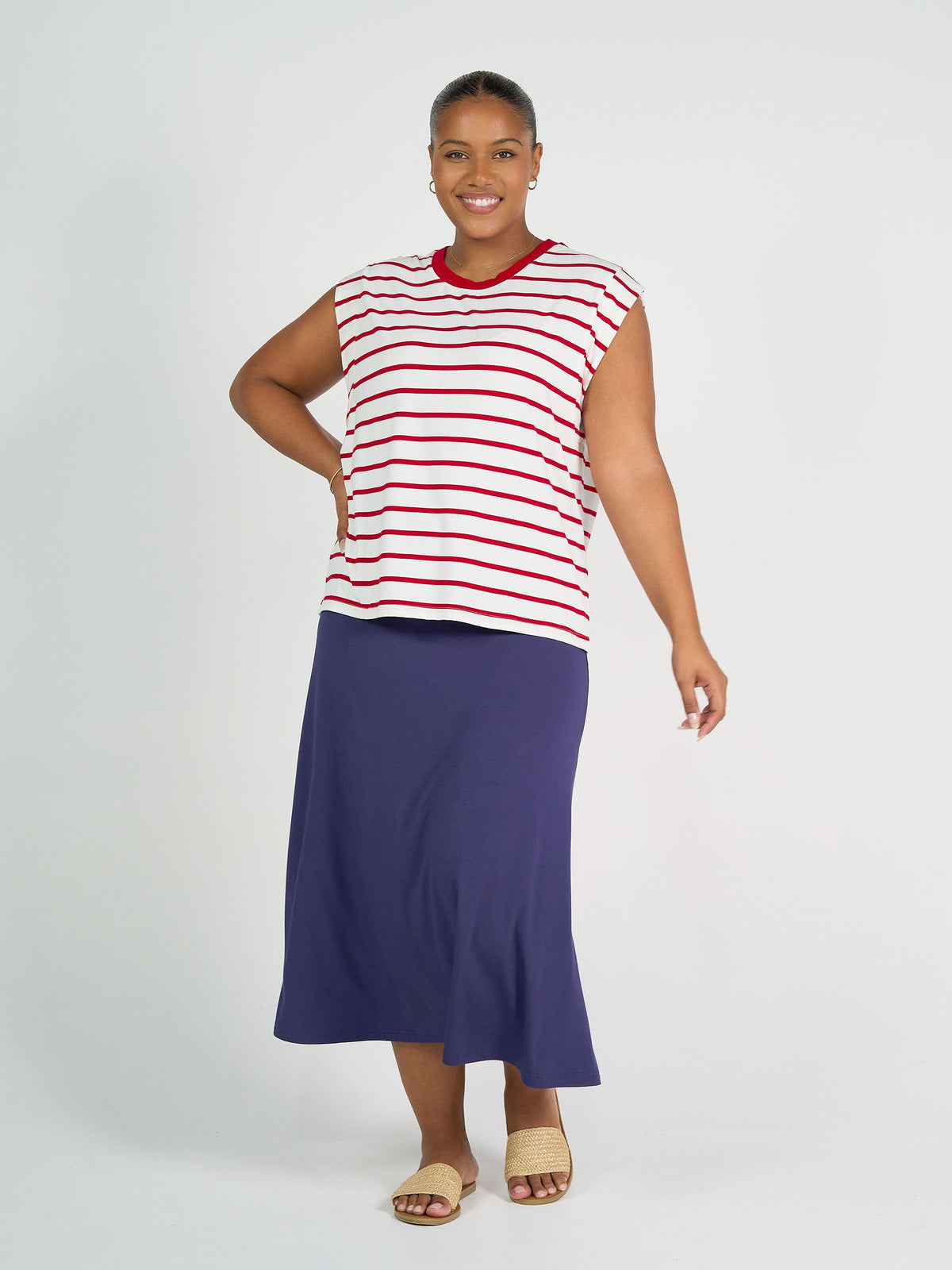 Image of a model wearing Tops. Product name - Donna Cap Sleeve Bamboo Tee Lipstick & White Stripe in Lipstick & White Stripe colour by brand - Lou Lou
