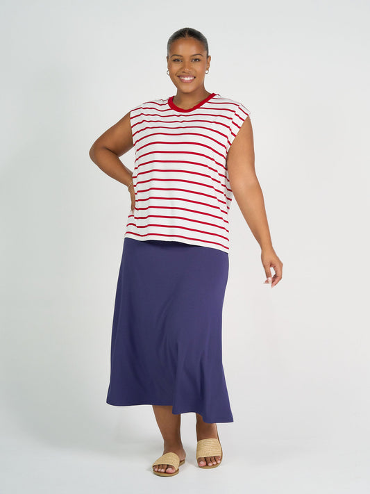 Image of a model wearing Tops. Product name - Donna Cap Sleeve Bamboo Tee Lipstick & White Stripe in Lipstick & White Stripe colour by brand - Lou Lou