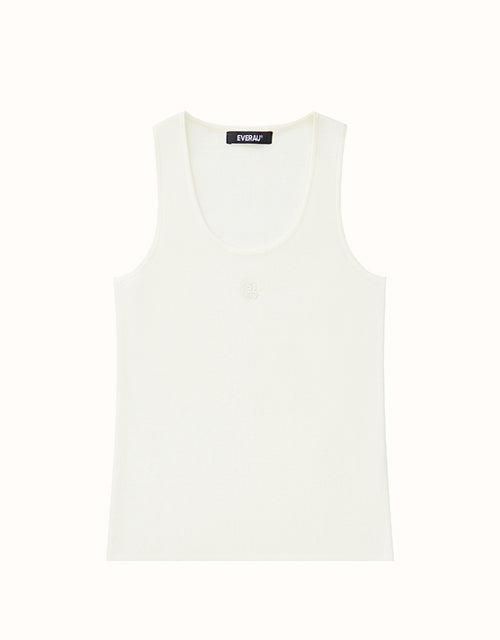 Image of a model wearing Tops. Product name - EVERAU® Arin Tank in White colour by brand - Everau