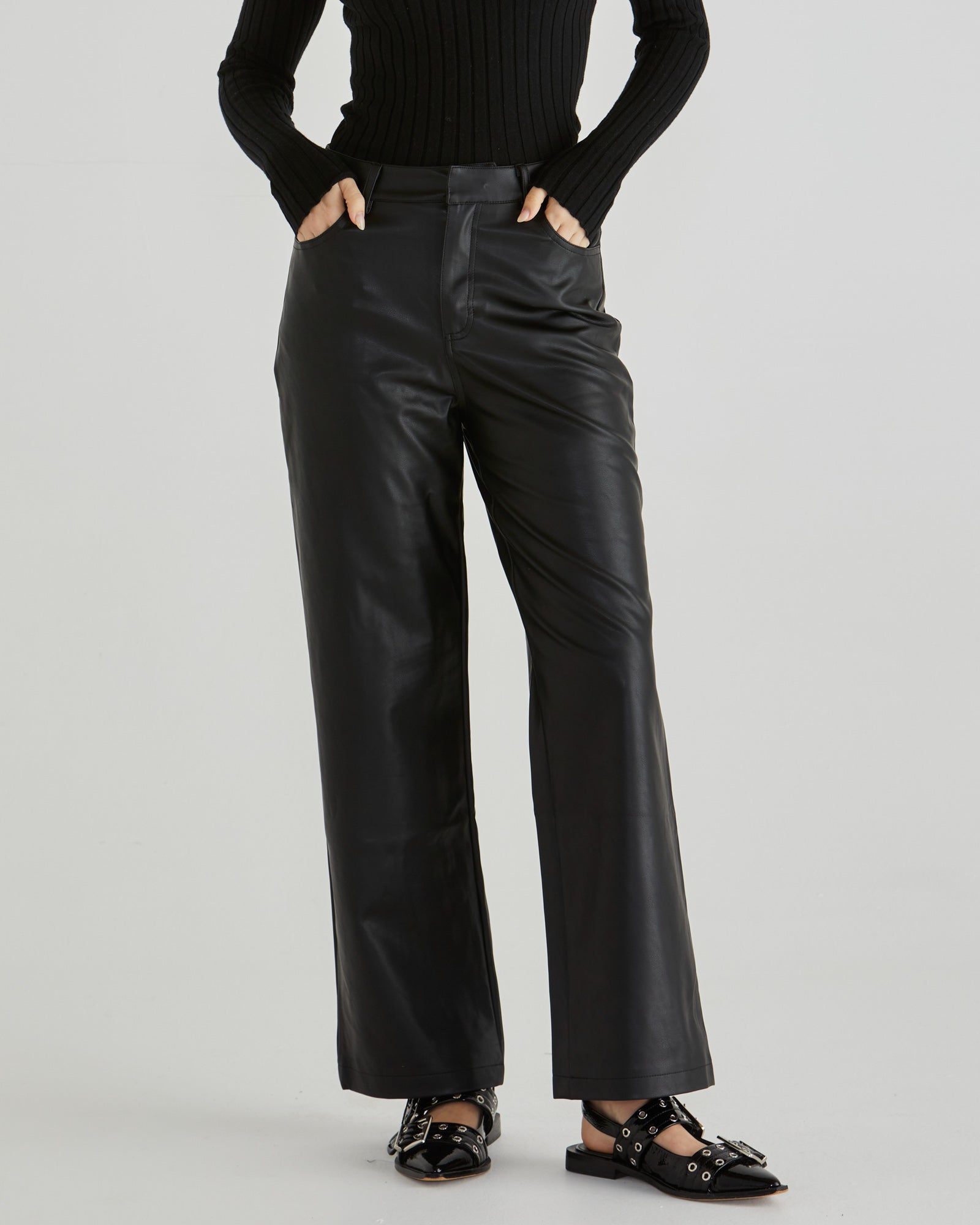 Image of a model wearing Pants. Product name - Sola Pu Pant Black in Black colour by brand - Sass Clothing