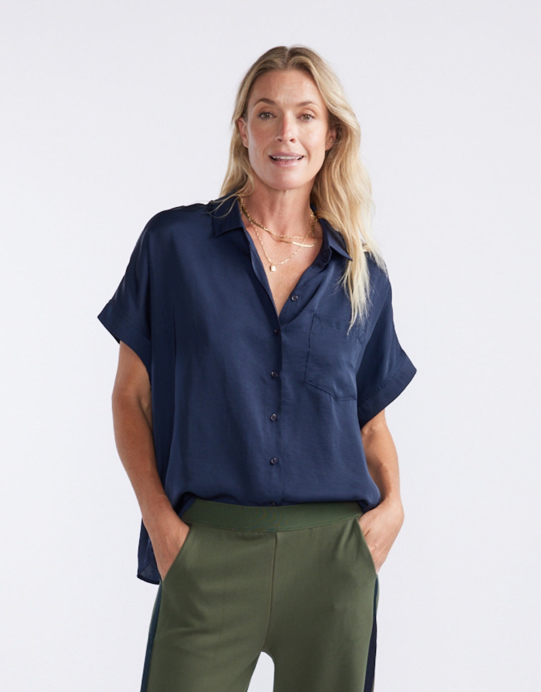 Image of a model wearing Tops. Productname: Effortless Drape Shirt - in Dark Navy colour by brand - White & Co.
