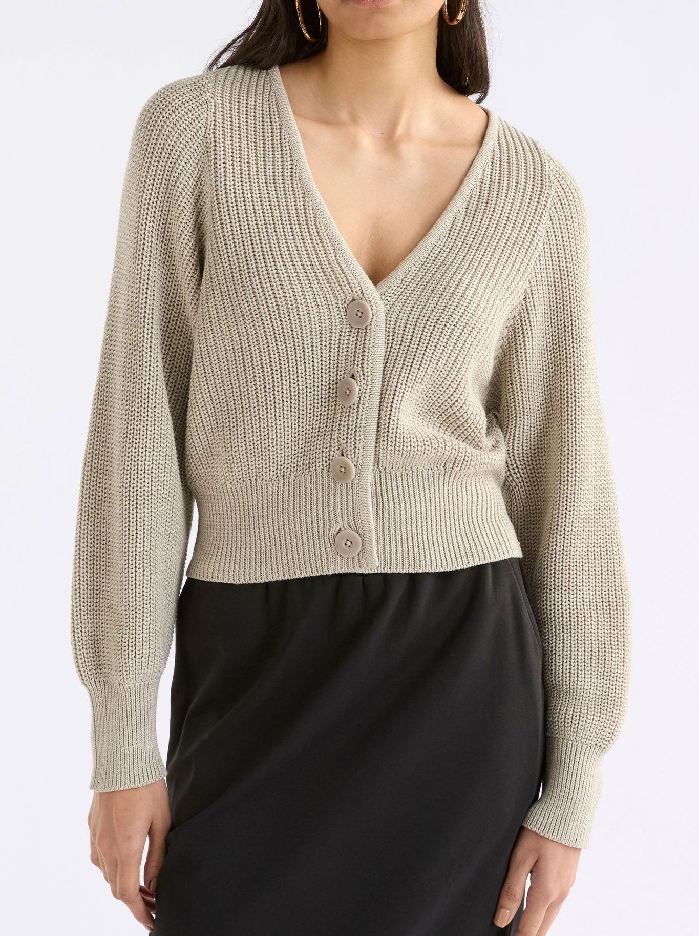 Image of a model wearing Outerwear. Productname: Elk Saari Cardigan in Ecru colour by brand - Elk