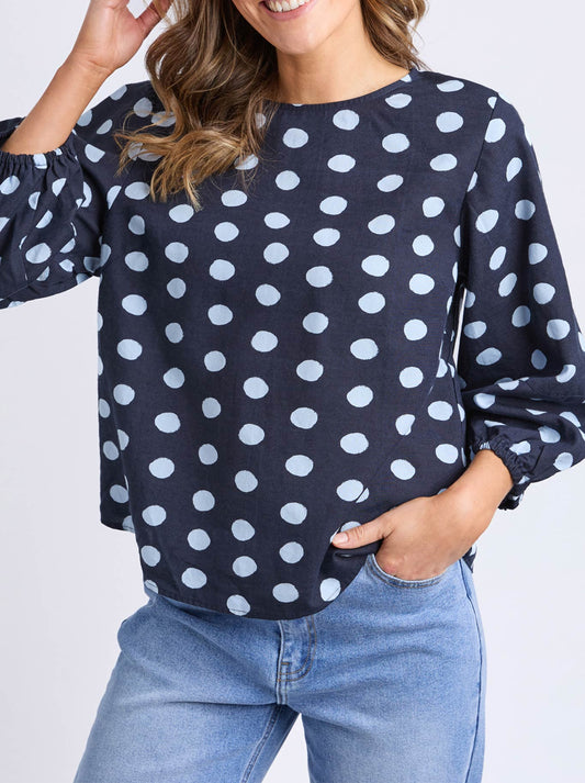 Image of a model wearing Tops. Productname: ELM DOTTY TOP in Navy colour by brand - Elm