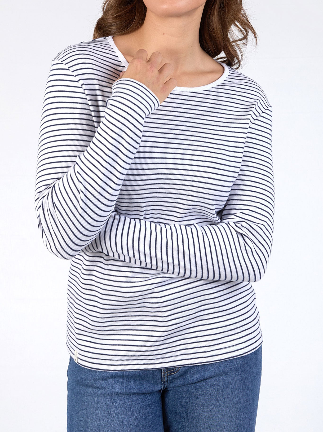 Image of a model wearing Tops. Product name - Elm Hayley Rib Long Sleeve Tee in White Navy colour by brand - Elm