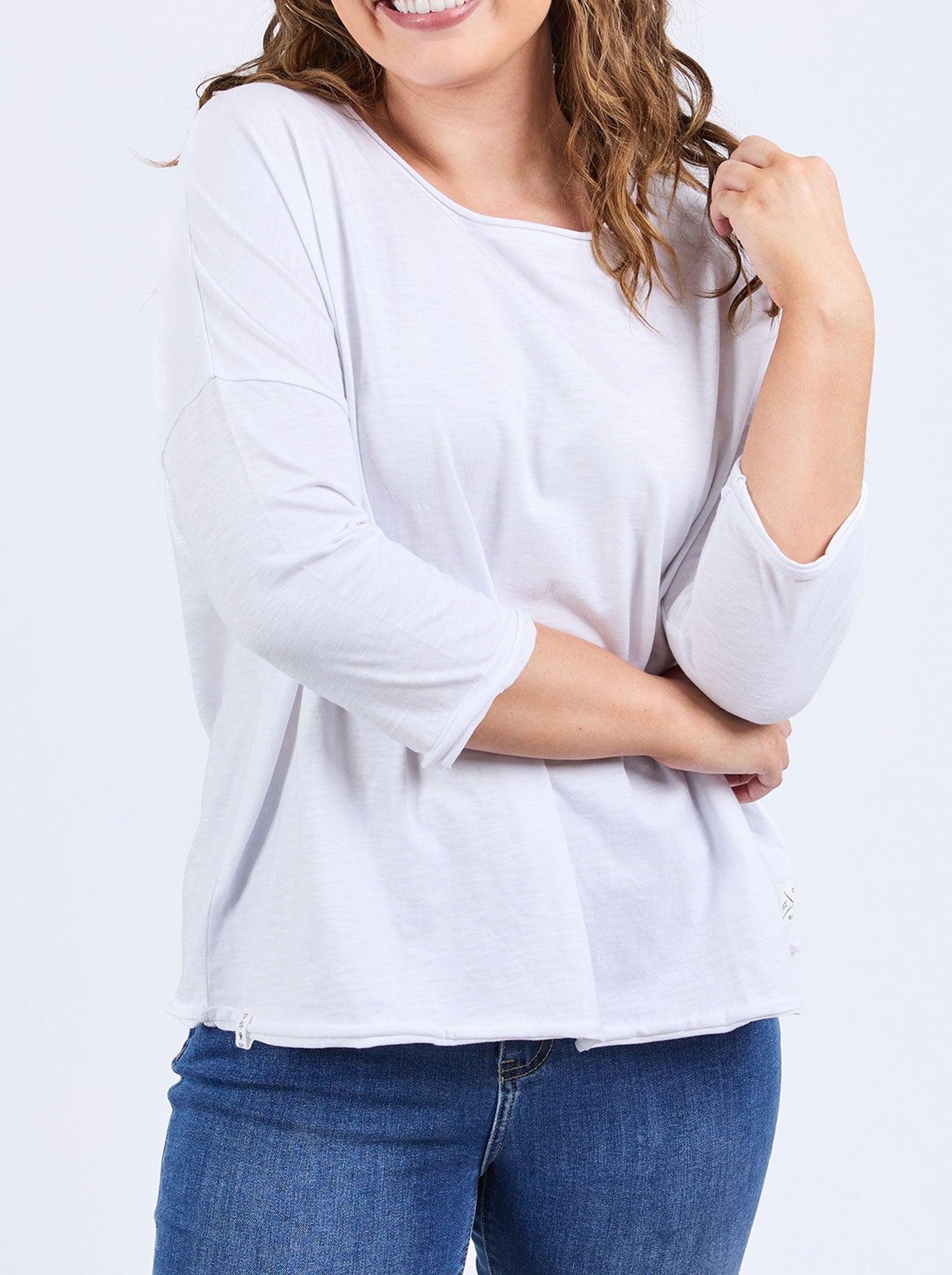 Image of a model wearing Tops. Product name - Elm Anya Top in White colour by brand - Elm