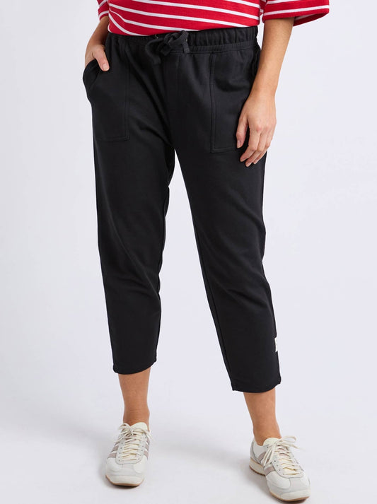 Image of a model wearing Pants. Productname: ELM SUTTON TRACK PANT in Black colour by brand - Elm