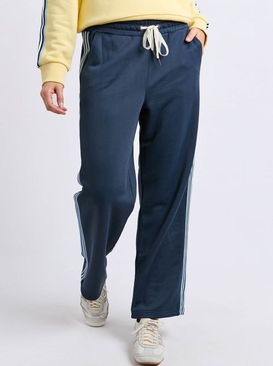 Image of a model wearing Pants. Productname: ELM AMARA TRACKPANT in Dark Sapphire colour by brand - Elm