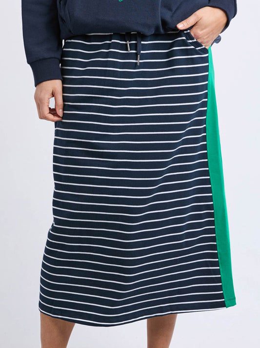 Image of a model wearing Skirts. Productname: Elm Stripe Sloane Skirt in Navy White Stripe colour by brand - Elm