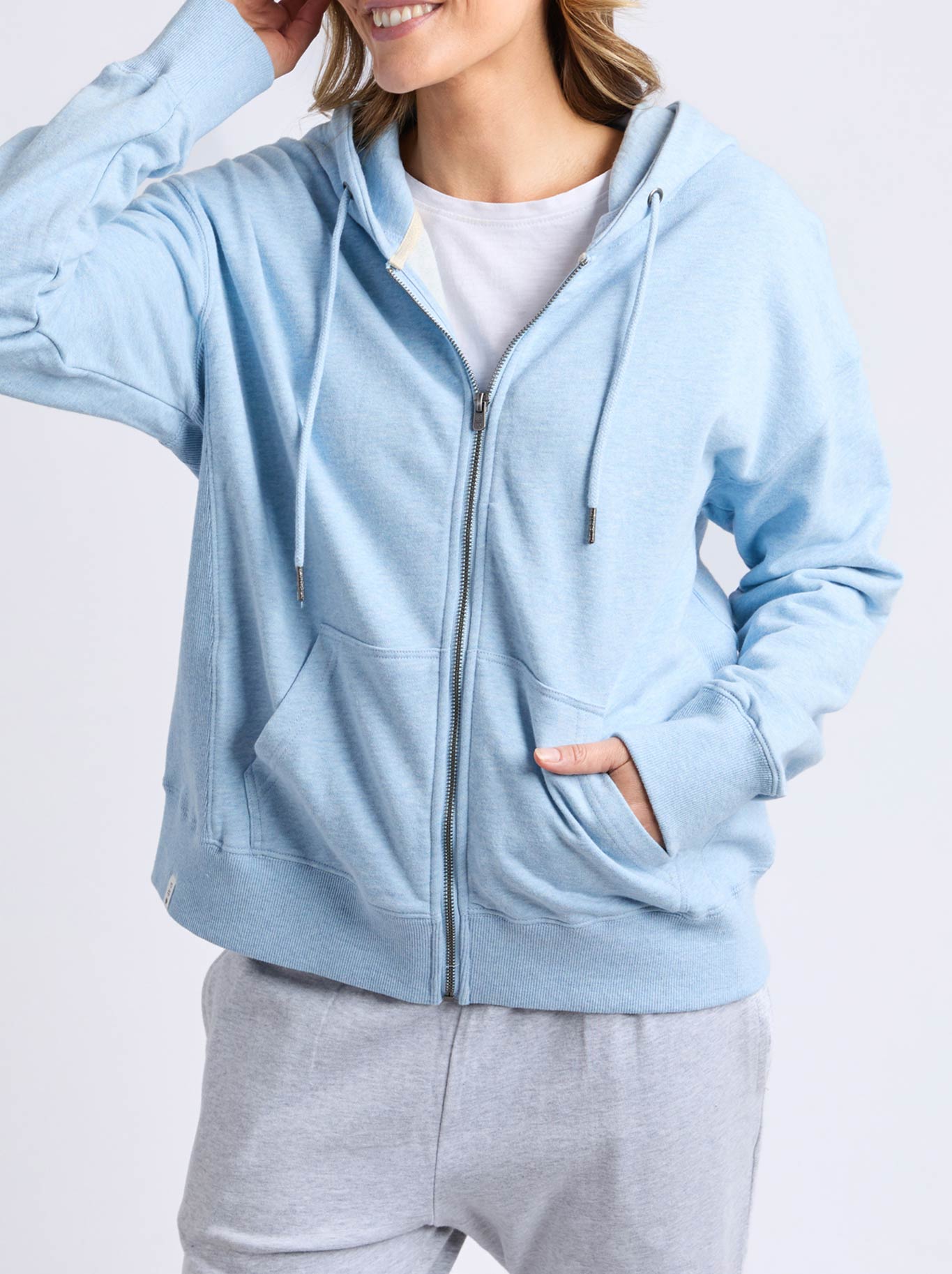 Image of a model wearing Outerwear. Productname: Elm Lydia Zip Hoodie in Pale Blue colour by brand - Elm