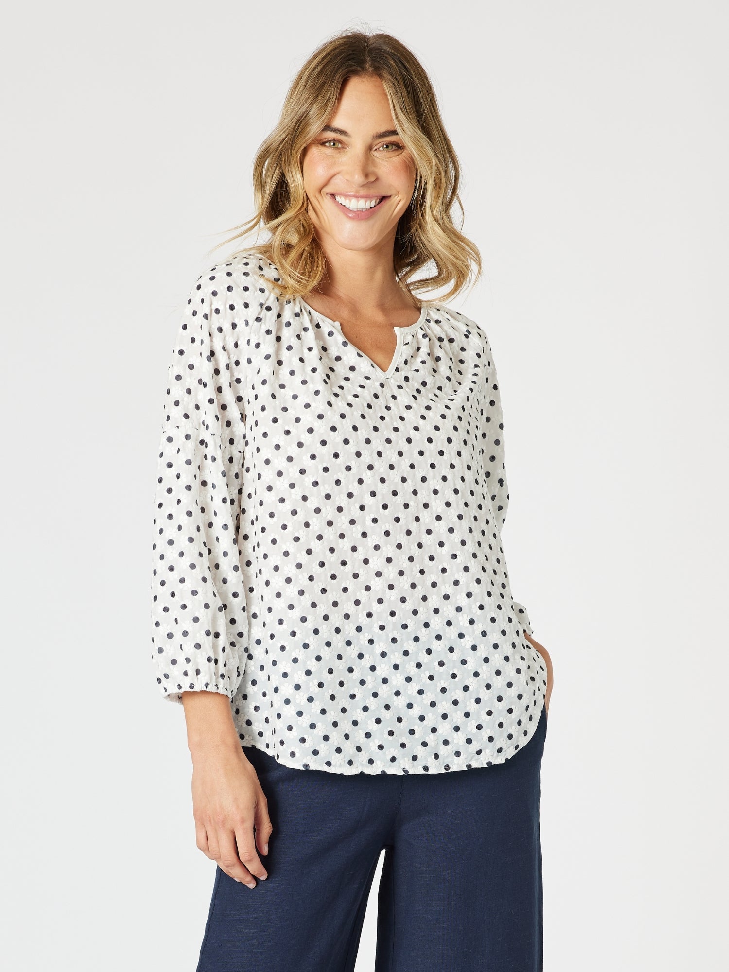 Image of a model wearing Tops. Product name - Get Dotty Embroidered Top Navy/White in Navy/White colour by brand - Gordon Smith
