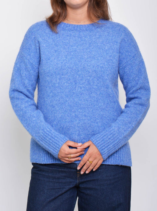 Image of a model wearing Outerwear. Product name - Enni Crew Knit in Blue colour by brand - Enni