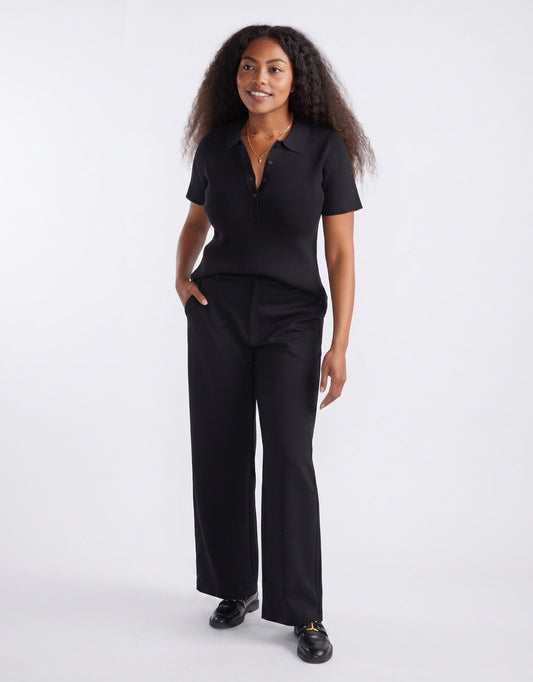 Image of a model wearing Pants. Product name - Effortless Ponte Pant Black/Black in Black/Black colour by brand - White & Co.