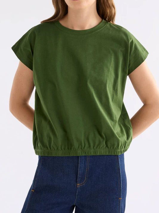 Image of a model wearing Tops. Product name - ELK KRUIS TEE in Olive colour by brand - Elk