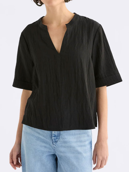 Image of a model wearing Tops. Productname: ELK KYSTEN TOP in Black colour by brand - Elk