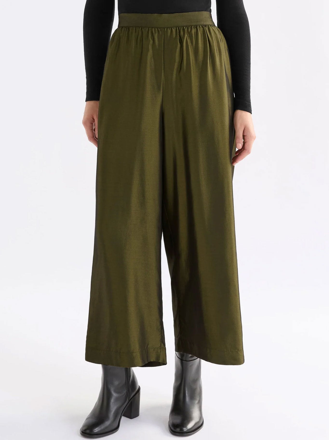 Image of a model wearing Pants. Productname: ELK MEDJAL PANT in Gold Black colour by brand - Elk