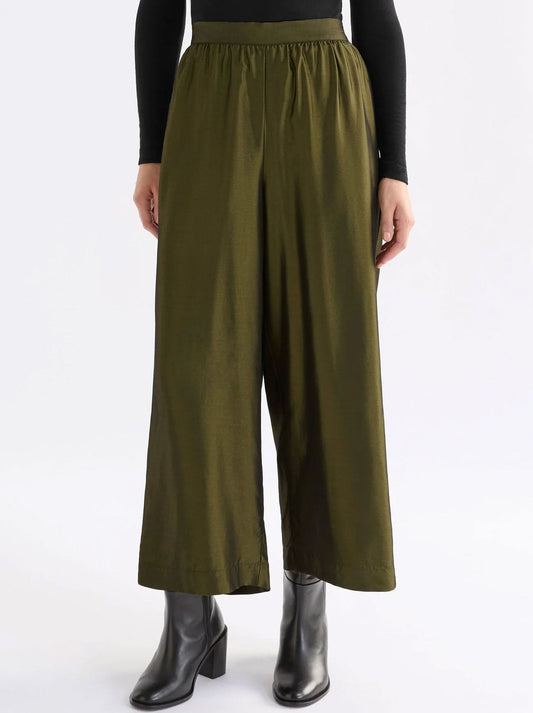 Image of a model wearing Pants. Productname: ELK MEDJAL PANT in Gold Black colour by brand - Elk