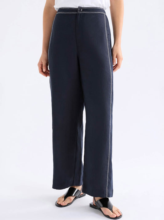 Image of a model wearing Pants. Product name - Elk Sonnen Pant in Midnight colour by brand - Elk